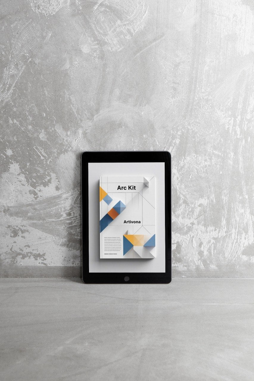 Tablet displaying an app interface on a gray surface with a textured wall background