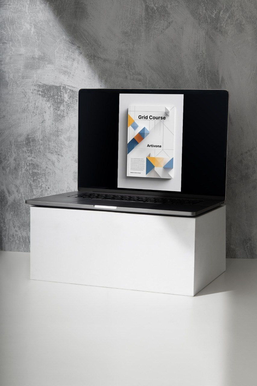 Laptop on a white stand with a gray concrete wall background